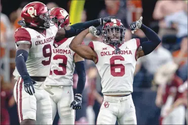  ?? Associated Press photo ?? Oklahoma cornerback Tre Brown (6) celebrates his safety during the Big 12 Conference championsh­ip NCAA college football game against Texas in Arlington, Texas, on Saturday. Oklahoma was named ot the college football playoff on Sunday.