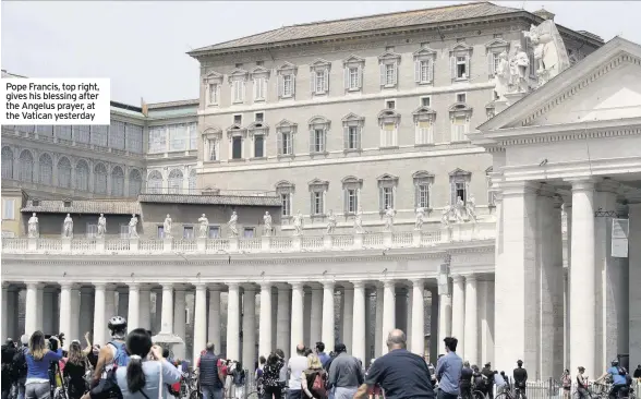  ??  ?? Pope Francis, top right, gives his blessing after the Angelus prayer, at the Vatican yesterday