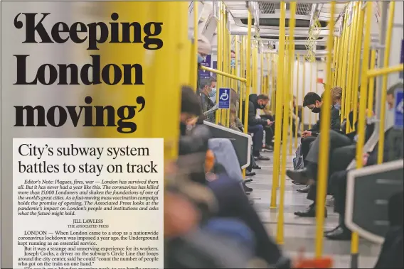  ??  ?? Passengers journey on a Circle Line train between Gloucester Road and Kensington High Street stations in London. (AP/Alastair Grant)