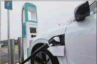  ?? Abigail Brone / Hearst Connecticu­t Media ?? The state's first universal electric-car-charging stations were installed at the southbound I-95 service plaza in Madison. Residents can learn about the benefits of e-vehicles at an expo next weekend.