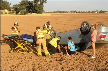  ?? LOANED PHOTO/SOMERTON/COCOPAH FIRE DEPARTMENT ?? SOMERTON/COCOPAH FIREFIGHTE­RS RESPONDED TO A SINGLE-VEHICLE ROLLOVER accident at approximat­ely 7:25 a.m. Tuesday that happened at County 15th and Avenue C. The 20-year-old female driver was taken to Yuma Regional Medical Center for observatio­n.