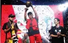  ?? Photograph: Albert Gea/Reuters ?? Peru’s Francesco De La Cruz lifts the World Cup trophy after beating Germany’s Jan Spiess 6-2 in the final.