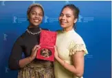  ??  ?? Producer Monica Sorelle (left) and screenwrit­er Keisha Rae Witherspoo­n pose with the trophy “Golden Bear for Best Short Film”.