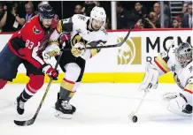  ?? ALEX BRANDON/AP PHOTO ?? Capitals forward Jay Beagle is all over Vegas Golden Knights defenceman Shea Theodore as he tries to move the puck during Game 3 of the Stanley Cup finals, won 3-1 by Washington. The Caps’ “team-defence” mantra has stifled the Vegas offence in the...