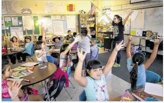  ?? RALPH BARRERA / AMERICAN-STATESMAN ?? Students at Austin’s Pleasant Hill Elementary learn math in a creative way with the help of third-grade
instructor Stephanie Nguyen. There is a national pushback over requiring principal and teacher evaluation­s to be based largely on the test...