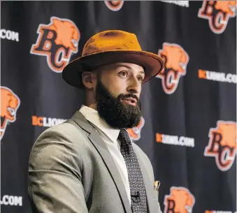  ?? DARRYL DYCK/THE CANADIAN PRESS ?? Quarterbac­k Mike Reilly speaks to the media after agreeing to a four-year contract with the B.C. Lions on Tuesday, the opening day of CFL free agency.