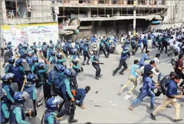  ?? AFP ?? Bangladesh police charge towards activists of the Bangladesh Nationalis­t Party protesting following a verdict against opposition leader Khaleda Zia in Dhaka yesterday.