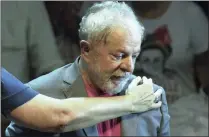  ?? PICTURE: AP ?? Brazil’s former president Luiz Inacio Lula da Silva is embraced during a rally in Rio de Janeiro last week.