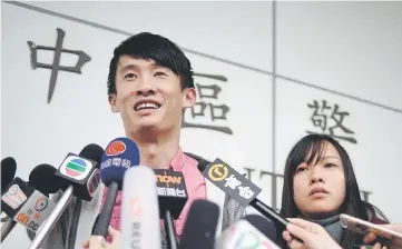  ??  ?? Yau (right) and Baggio speak to the press after their release from Central Police Station in Hong Kong. — AFP photo