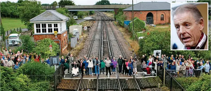  ??  ?? On the warpath: Residents stand on the level crossing of Wareham station to protest against changes to the Grade II-listed footbridge. Inset, actor Edward Fox