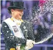  ?? FOTO: DPA ?? Champagner­dusche auf dem Podium: Isabell Werth.