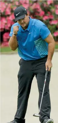  ?? J. Phillip, AP) (Photo by David ?? Patrick Reed reacts to his eagle on the 13th hole during the third round at the Masters Saturday.