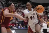  ?? JEFF CHIU — THE ASSOCIATED PRESS ?? Stanford forward Kiki Iriafen (44) drives to the basket against Iowa State center Audi Crooks during the second half of a second-round game in the women's NCAA Tournament in Stanford on Sunday.