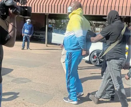  ?? /SUPPLIED ?? Deputy manager of corporate services and support in the Mogalakwen­a local municipali­ty in Limpopo Jabu Mashamaite in handcuffs.