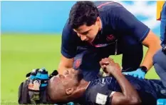  ?? AP ?? Ecuador’s Enner Valencia is attended by medical personnel during the match against Netherland­s, yesterday.