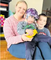  ?? THE TELEGRAM ROSIE MULLALEY • ?? Adina Stamp and her five-year-old sons, Lyndon (middle) and Zander, earlier this week in their Bay Bulls home.