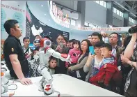  ?? DENG GANG / FOR CHINA DAILY ?? Xiao I, a robot produced by local high-tech company Xiaoi Robot Technology, is displayed at last year’s big data expo.