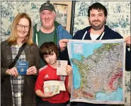  ?? JESI YOST — FOR MEDIANEWS GROUP ?? Charlie Minsky, 10, with his father, Andrew, and grandparen­ts Christinia and Bart Minsky, found all four of the French Safehouse Escape Room items, completing the mission with just two minutes to spare at the General Carl Spaatz National USAAF Museum in Boyertown. The museum is planning an exclusive escape room in April.