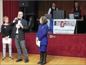  ?? LAURA QUAIN - DIGITAL FIRST MEDIA ?? Derek Mace (middle) stands with Sherrie (left) and Yvonne Fonte of Berks Democratic Women (right). Mace and his wife Karise and their three daughters organized a Gala on Feb. 11 to raise funds for Emerge Pa to help women in politics.