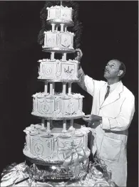  ??  ?? ORNATE CREATION: Peter Gee with the 5ft high cake which he made for the Royal wedding of Duke and Duchess of Kent, June 1961.