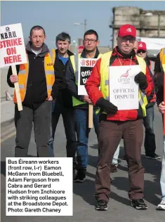  ??  ?? Bus Éireann workers (front row, l-r) Eamon McGann from Bluebell, Adam Ferguson from Cabra and Gerard Hudson from Inchicore with striking colleagues at the Broadstone Depot. Photo: Gareth Chaney
