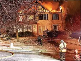  ?? PHOTO FROM TRAPPE FIRE COMPANY ?? Firefighte­rs were called to a home on the 500block of Tawnyberry Road Dec. 16for a working house fire. All three residents and their pets escaped safely.