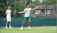  ?? Thomas Lovelock / Associated Press ?? Novak Djokovic and his coach Goran Ivanisevic work on the practice courts at Wimbledon on Friday.