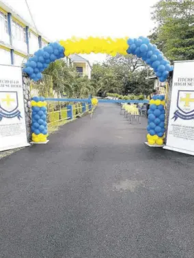  ??  ?? The newly paved Lloyd O Chin Drive at Titchfield High School in Port Antonio, Portland. The driveway is named in honour of the late former principal who served from 1976 to 1992.