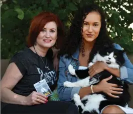  ?? BARRY GRAY, THE HAMILTON SPECTATOR ?? Shelley Morley and daughter Chloe, 18, with their cat Jude. Shelley gave Paul McCartney a manicure before his concert in Hamilton Thursday.