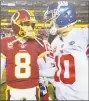  ?? The Washington Post ?? Giants quarterbac­k Eli Manning, right, greets Redskins quarterbac­k Kirk Cousins after a game.