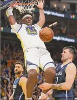  ?? Jed Jacobsohn / Associated Press ?? Warriors center Kevon Looney dunks against the Mavericks. The game didn’t end in time for this edition. For a full report, go to www.timesunion.com.