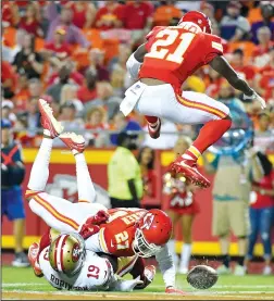  ?? JOHN SLEEZER/TRIBUNE NEWS SERVICE ?? Kansas City Chiefs cornerback Kenneth Acker (27) breaks up a pass intended for San Francisco 49ers wide receiver Aldrick Robinson as defensive back Eric Murray (21) leaps over the play at Arrowhead Stadium in Kansas City, Mo., on Friday.