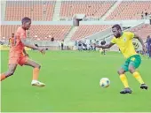  ??  ?? Polokwane City defender, Kenneth Nthatheni (orange) and Golden Arrows striker, Knox Mutizwa contest for possession of the ball during their match at Peter Mokaba Stadium on Sunday.