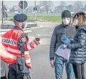  ?? Picture: REX/Shuttersto­ck. ?? Police carry out checks in Castiglion­e d’Adda.