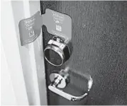  ?? ALYSSA SCHUKAR/THE NEW YORK TIMES ?? A paper seal on doors at Hilton McLean Tysons Corner in McLean, Va., lets guests know a room has been cleaned.