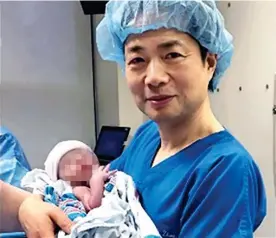  ?? ?? HISTORY IN THE MAKING: Dr John Zhang in a Mexican hospital with the world’s only confirmed three-parent baby after its birth in 2016