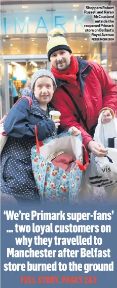  ?? PETER MORRISON ?? Shoppers Robert Russell and Karen McCausland outside the reopened Primark store on Belfast’sRoyal Avenue