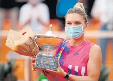  ??  ?? Simona Halep celebrates after winning the Italian Open in Rome this week.