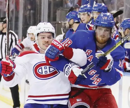  ?? BRUCE BENNETT/GETTY IMAGES ?? Canadiens forward Max Domi tries to fight his way past New York Rangers defenceman Marc Staal Tuesday during Montreal’s 5-3 loss at Madison Square Garden. Despite the loss, Domi picked up his ninth goal in his last 10 games.