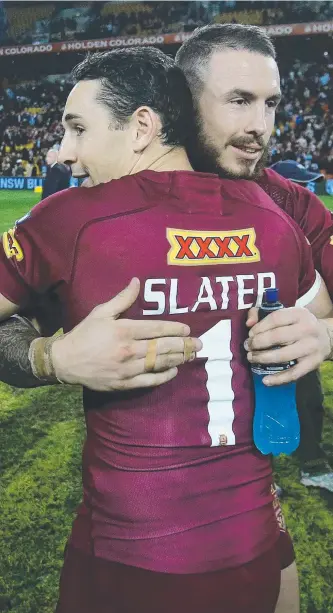  ?? Picture: PETER WALLIS ?? Billy Slater and Darius Boyd embrace after a Maroons Origin win.