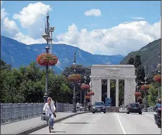  ?? Rick Steves’ Europe/DAVE HOERLEIN ?? Tirol was ceded by Austria (loser) to Italy (winner), Mussolini suppressed Germanic cultural elements and built fascist-style monuments like Bolzano’s Victory Gate to make the city feel more Italian.