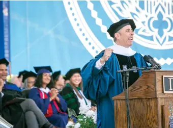  ?? BILL SNEAD/DUKE UNIVERSITY VIA AP ?? Comedian and sitcom star Jerry Seinfeld speaks during Duke University’s graduation ceremony on Sunday in Durham, N.C. A tiny contingent of graduates opposed the pro-Israel comedian speaking at their commenceme­nt.