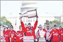  ??  ?? Washington Capitals’ Alex Ovechkin, of Russia, holds up the Stanley Cup trophy during the NHL hockey team’s Stanley Cup victory celebratio­n on
June 12, at the National Mall in Washington. (AP)