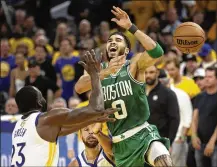  ?? JED JACOBSOHN / ASSOCIATED PRESS ?? Boston Celtics forward Jayson Tatum (0) loses the ball while being defended by Golden State Warriors forward Draymond Green (23) and guard Stephen Curry during the second half of Game 2 of the NBA Finals in San Francisco, Sunday.
