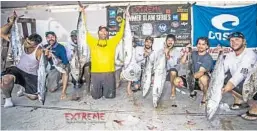  ?? EXTREME KAYAK FISHING/COURTESY ?? Jim Jobson (yellow shirt) caught two kingfish weighing a total of 34.6 pounds Saturday to win the Summer Slam Part 1 offshore kayak fishing tournament out of Pompano.