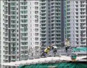  ?? BLOOMBERG ANTHONY KWAN / ?? A residentia­l building under constructi­on at Kai Tak in Hong Kong. The city’s homes prices have hit record highs after rising for the 13th straight month in April, according to recent report.