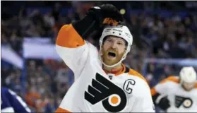  ?? CHRIS O’MEARA — THE ASSOCIATED PRESS ?? Philadelph­ia Flyers center Claude Giroux (28) celebrates after scoring against the Tampa Bay Lightning during the third period of Saturday’s game.