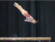  ?? [SARAH PHIPPS/ THE OKLAHOMAN] ?? OU's Bre Showers dismounts the balance beam in the Perfect 10 Challenge against Nebraska at Cox Convention Center on Feb. 16, 2018.