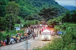  ?? LINH PHAM / GETTY IMAGES ?? An ambulance carrying one of the boys rescued from Tham Luang Nang Non cave heads to the hospital Sunday in Chiang Rai, Thailand. Acting Gov. Narongsak Osatanakor­n had dubbed Sunday to be “D-day” for the complicate­d rescue effort.