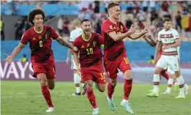  ?? Photograph: Thanassis Stavrakis/AP ?? Belgium’s Axel Witsel, Eden Hazard and Thorgan Hazard celebrate the latter’s goal against Portugal.